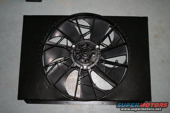 Black radiator fan shroud with a black fan, viewed from the front