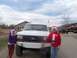1989 Ford Bronco - People in Santa hats pose with a 1989 Ford Bronco during a holiday event.