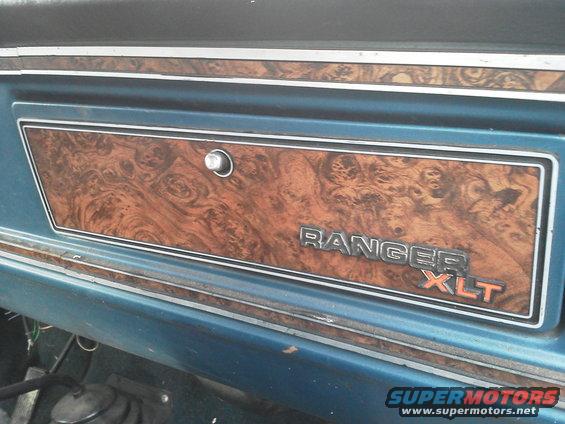 Interior trim panel with wood grain and RANGER XLT badging