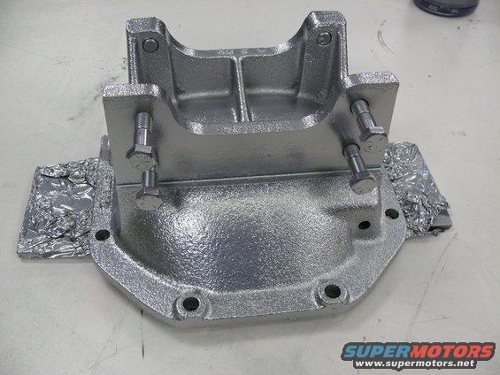 Differential cover with bolts attached, some foil on the sides