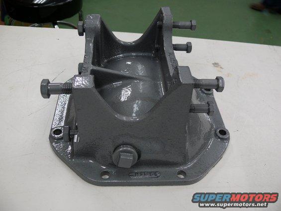 Gray metal differential housing part with bolts attached