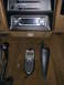 1990 Ford Bronco - The interior of a 1990 Ford Bronco shows a tan dashboard with an aftermarket radio and climate controls.