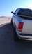 2005 Dodge 1500 - This pickup truck is parked on a sandy incline with the rear facing the camera.