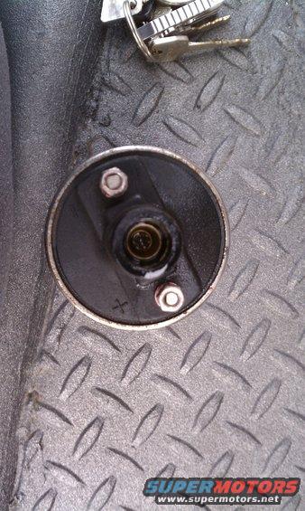 Distributor cap with keys on diamond plate surface