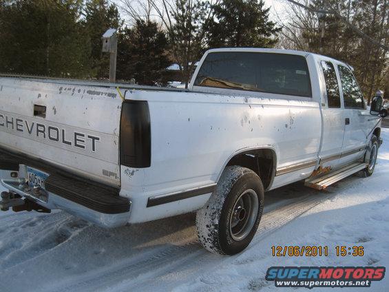 White Chevrolet pickup truck, rear 3/4 view. Dated 12/06/2011