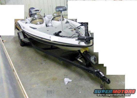 bass boat on a trailer in a garage