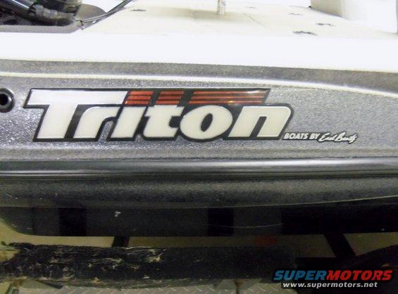 Boat hull with "Triton" logo and "Boats by Earl Bentz" text