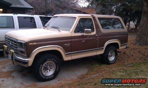 Brown and tan SUV, 3/4 front view