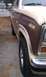 1984 Ford Bronco - Front fender and wheel of a two-tone brown and tan Ford Bronco from the early 1980s.