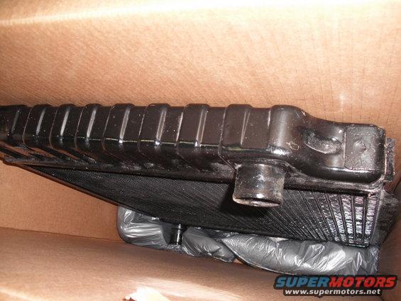Black radiator part in cardboard box