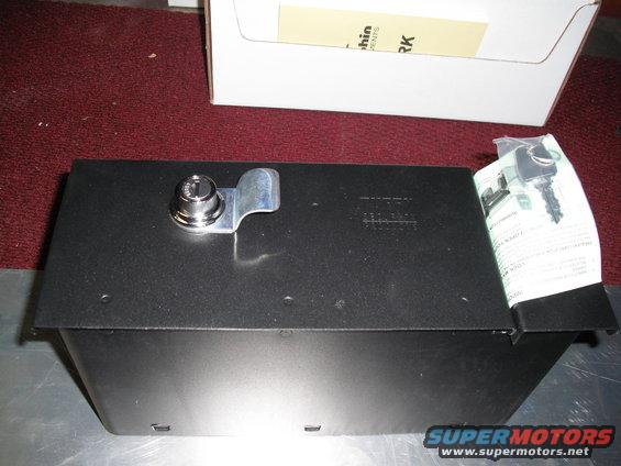 Black metal lockbox with a silver cam lock and two keys, next to instructions