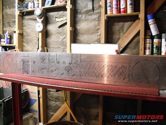 Metal panel with drawn circles for gauges labeled 'SPEED', 'TACH', 'OIL', 'BATT', and 'TEMP'