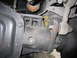 2008 Ford F-450 - Undercarriage view of a vehicle's rear axle and suspension system, with visible wear and tear.