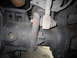 2008 Ford F-450 - A detailed view of a vehicle's suspension system, focusing on the linkage and bracket assembly.