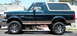 1995 Ford Bronco - This lifted 1995 Ford Bronco is shown from the side with custom wheels.