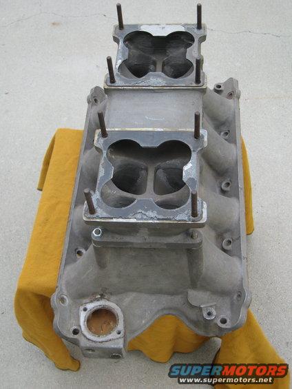 Aluminum dual quad intake manifold on yellow cloth