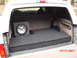 1996 Ford Bronco - The finished product with lids carpeted and subwoofer in place; note the cooling vent in the amp compartment lid