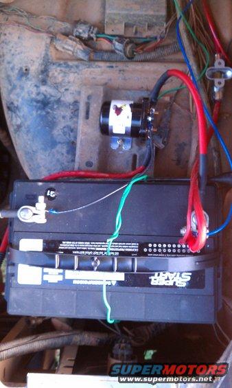 Engine bay wiring and battery. Super Start battery visible