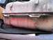 1986 Ford Bronco - This is a close-up of a vehicle's fuel tank, showing signs of rust and wear.