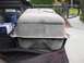 1986 Ford Bronco - A fuel tank is shown in the bed of a truck, with a blue container and a box of filters visible nearby.