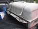 1986 Ford Bronco - A fuel tank, likely for a truck or SUV, is shown removed from a vehicle and placed on a protective mat.