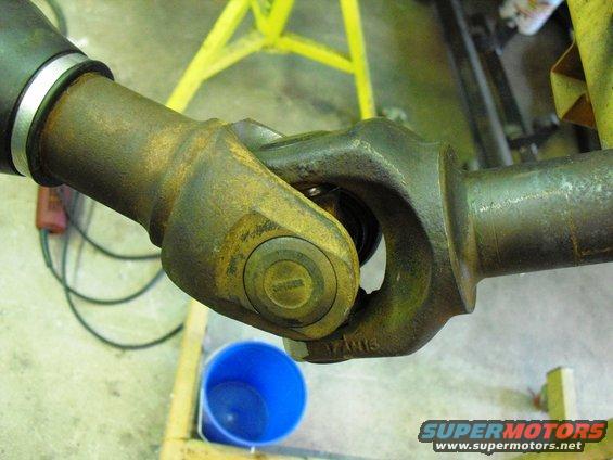 Driveshaft universal joint with visible text '17AN13' and Supermotors.net logo