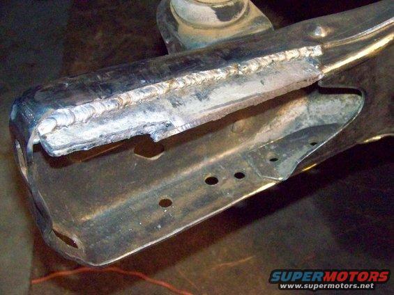 Welded metal frame part with Supermotors.net logo