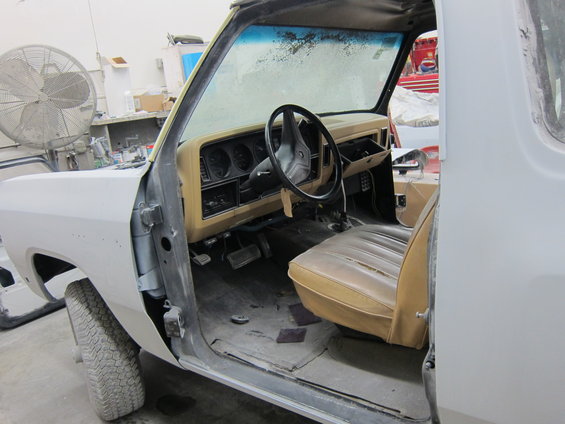 1987 Dodge 1500 interior showing tan seats, dashboard with gauges, and steering wheel