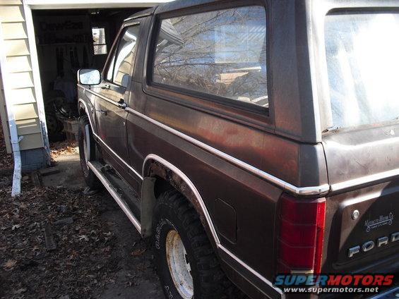 Brown 1986 Ford Bronco rear quarter view