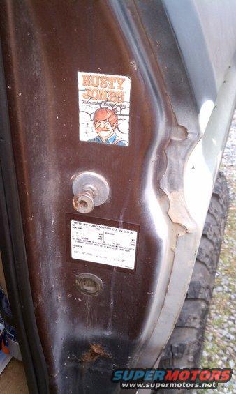 Door jamb sticker on a 1979 Ford Bronco with a Rusty Jones decal above it