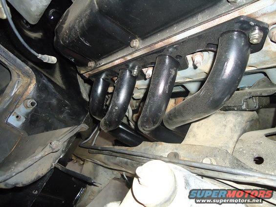 close-up of engine exhaust manifold pipes