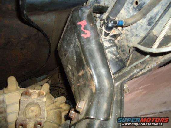 Underbody part with red markings and fuel lines