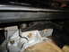 1987 Ford F-150 - A close-up view of a vehicle's engine mount bracket and associated hardware.