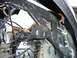 1987 Ford F-150 - Close-up view of the engine bay structure, showing the alternator and various wiring components.