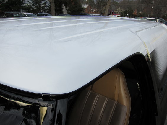 White vehicle roof and tan seat interior