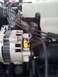 1994 GMC Sierra 3500 - The photo shows a close-up view of an engine bay, focusing on the alternator and associated wiring.