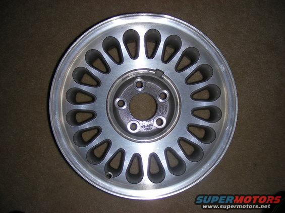Aluminum car wheel with 20 teardrop-shaped openings around the rim
