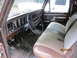 1969 Ford Mustang - The interior of a brown truck cab, a dashboard, steering wheel, and two-tone seats. A date stamp reads 05/15/2011.