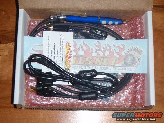 Box with Moates.net parts, cables, and a blue pen