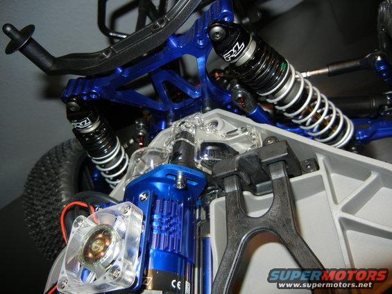 Blue suspension and motor assembly with RZ shocks on a remote control car