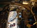 1995 Ford Bronco - Close-up view of engine bay components, including fuel injectors and wiring, with a towel and patch visible.