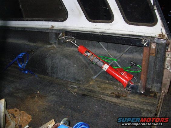 This is the main reason I built my own instead of buying one - storage, and accessibility.  It self-stows clear of the bed floor and below the bedrail.  I'll build another bracket to take the load off the jack, and to allow it to be locked down when the camper is off.  And everything it does can be done while the operator stands on the ground - no need to climb into & out of the bed.  I could add a small winch (manual or electric) to make it even more functional.