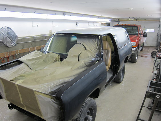 1987 Dodge Ramcharger in garage, partially covered for paintwork. Another truck is parked behind it