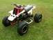 1995 Yamaha BANSHEE - Side view of a 1995 Yamaha BANSHEE ATV with red and white body panels.