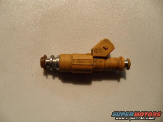 Yellow fuel injector with metal and rubber components, showing part number 13641703221