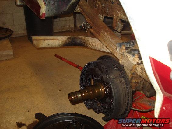 Rear drum brake assembly with grease on spindle