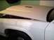 1991 Ford Crown Victoria - Side view of hood plate and paint damage.