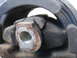 2003 Ford Taurus - Close-up of a damaged engine mount, showing wear and tear on the rubber and metal components.