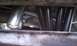 1979 Ford Bronco - Close-up view of exhaust headers and pipes, likely from a vehicle's undercarriage.