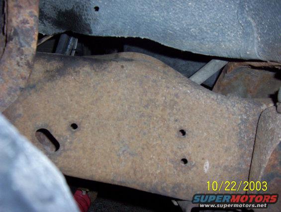 front part of frame behind bumper on right side